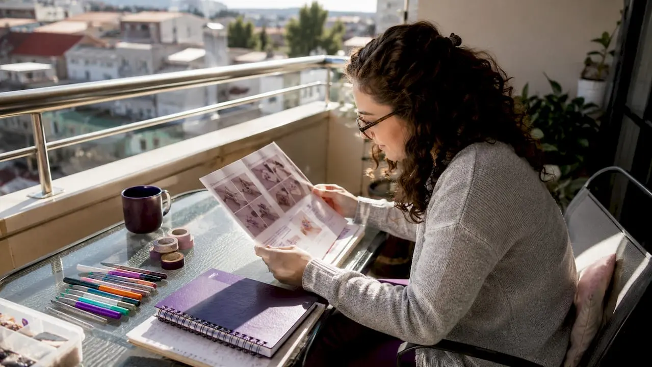 Woman reading crafting explainer article at table
