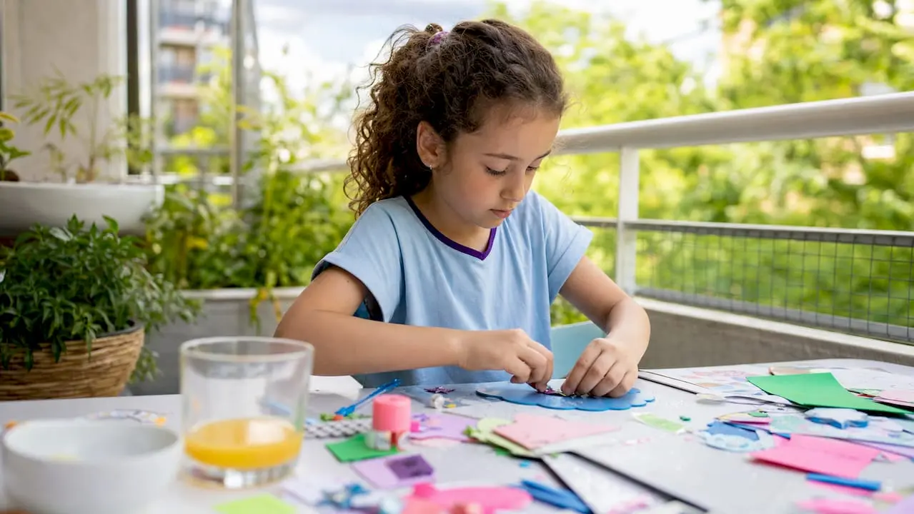 Child focused on themed craft kit project