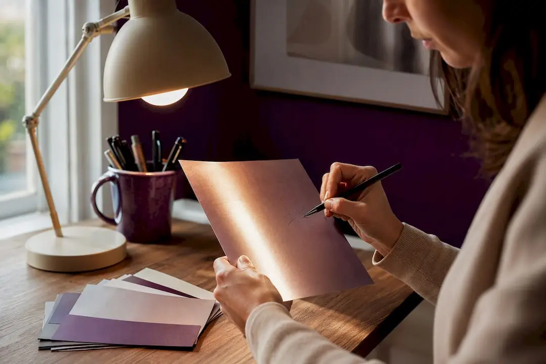 Crafter testing paper finish with pen