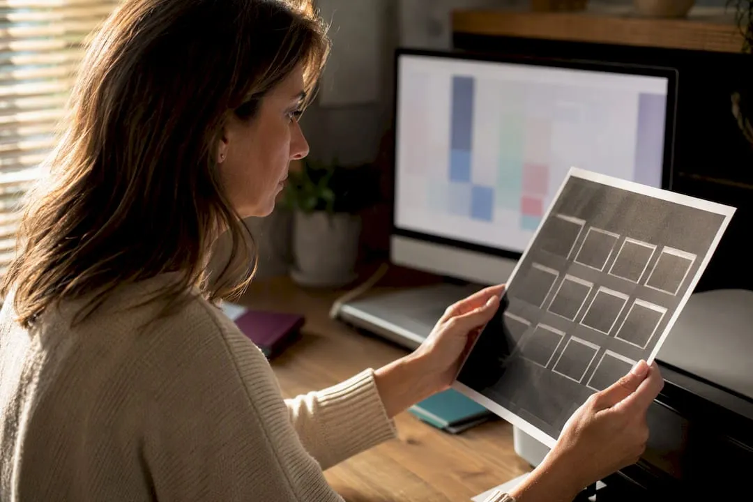 Crafter comparing dark test print and screen