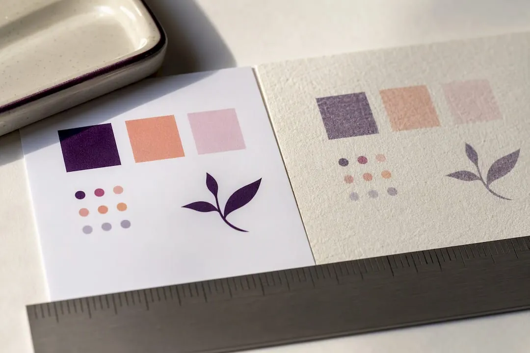 Coated and uncoated cardstock samples compared
